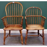 An early 19th century ash and elm bow back Windsor chair on turned supports,