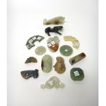 A group of fourteen Chinese jade and hardstone carvings, some in archaic style,