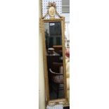 A pair of 20th century gilt framed rectangular wall mirrors with ribbon tied Romanesque portrait