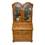 An 18th century German figured walnut double dome top bureau bookcase,