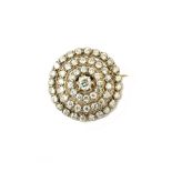 A diamond set pendant brooch, designed as a target,