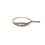 A diamond and cultured pearl set oval hinged bangle,