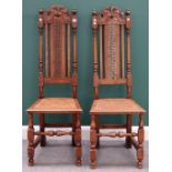 A pair of 17th century style beech and oak high back side chairs with turned supports.