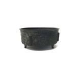 A Chinese archaistic bronze censer, of drum form, raised on three supports,