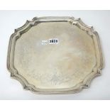 A Canadian silver salver of shaped square form, engraved with foliate and scroll decoration,