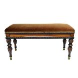 A 19th century French rosewood framed rectangular lift top piano stool on spiral fluted supports,