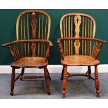 An early 19th century ash and elm Windsor chair with pierced splat and turned supports,