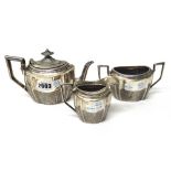 A Victorian silver three piece tea set, comprising;  a teapot,