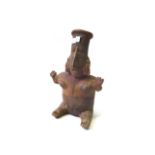 A group of Pre-Columbian and other terracotta figures and masks, the largest 30cm high,