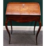 A Louis XV style marquetry inlaid rosewood gilt metal mounted bureau de dame, on cabriole supports,