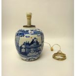 A Chinese blue and white oviform vase, circa 1900, painted with a seated official and attendants,