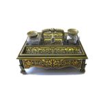 A Victorian brass inlaid tortoiseshell desk set, to include a blotter, a picture frame,