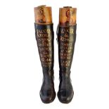 A pair of leather riding boots with wooden trees, early 20th century,