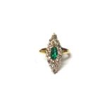 A gold, emerald and diamond set marquise shaped cluster ring,