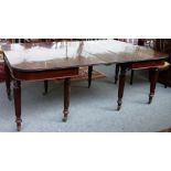 A George III mahogany extending dining table,