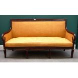 An early 19th century French mahogany framed sofa with bow seat on sabre supports, 180cm wide.