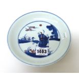 A Chinese porcelain saucer dish, Yongzheng mark but later,