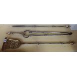 A set of three steel and brass mounted fire tools and a steel serpentine fender, 116cm wde.