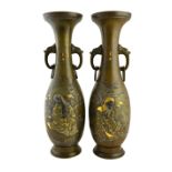 A pair of Japanese bronze two-handled vases, Meiji period, of slender baluster form,