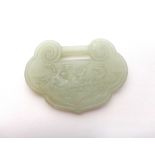 A Chinese pale celadon jade buckle, 19th/20th century, of ruyi form,