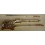 A set of Victorian brass fire irons with wrythen twist handles and knopped shafts,