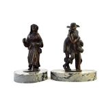 A pair of Italo-Flemish bronze figures of a woman and a pedler, the later after Giambolgna,
