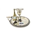 A George IV silver chamber candlestick, of circular form, decorated with gadrooned rims,