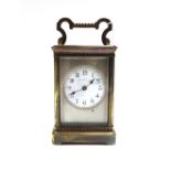 A gilt brass cased carriage clock, early 20th century, the white enamel dial detailed Mappin & Webb,