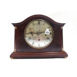 A mahogany cased mantel clock, circa 1900, the domed case over a silvered 7.