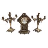 A gilt brass mantel clock garniture, circa 1900,