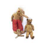 A vintage teddy bear with golden fur, hand stitched snout and jointed limbs, 37cm high,