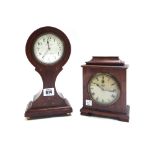 An Edwardian mahogany and inlaid balloon shaped mantel clock,