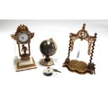 A Victorian brass pocket watch stand, the frame raised on spiral twist columns, 16cm high,