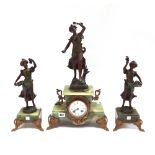 A onyx and spelter mounted figural clock garniture, early 20th century,