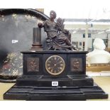 A Victorian black slate cased mantel clock with a bronze female surmount emblematic of 'Harvest',