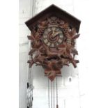 A Black Forest carved wooden cuckoo clock, early 20th century,