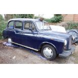 A 1990 Carbodies Fairway 15 London Taxi, navy blue, 2664cc. Registration: N804 AML.