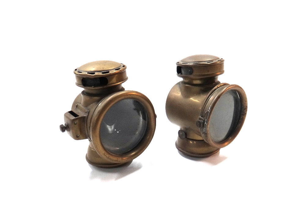 Two similar early 20th century brass cased five inch automobile lights.