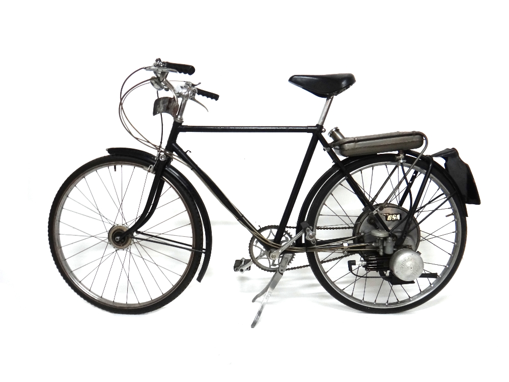 A 1953 gentleman's Raleigh bicycle fitted with a 35cc BSA winged wheel engine, black,