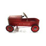 A Triang tin plate 'Royal Prince' pedal car, red, 75cm long.