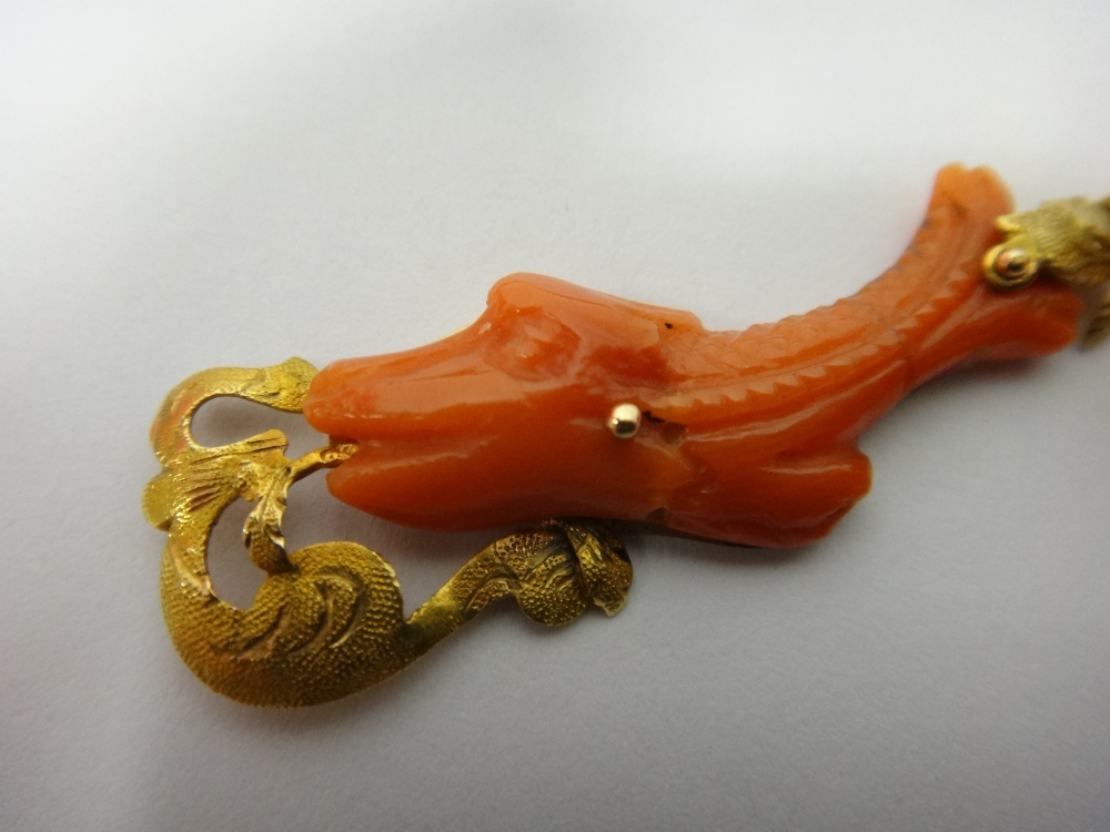 A pair of gold and carved coral pendant earrings, - Image 2 of 2