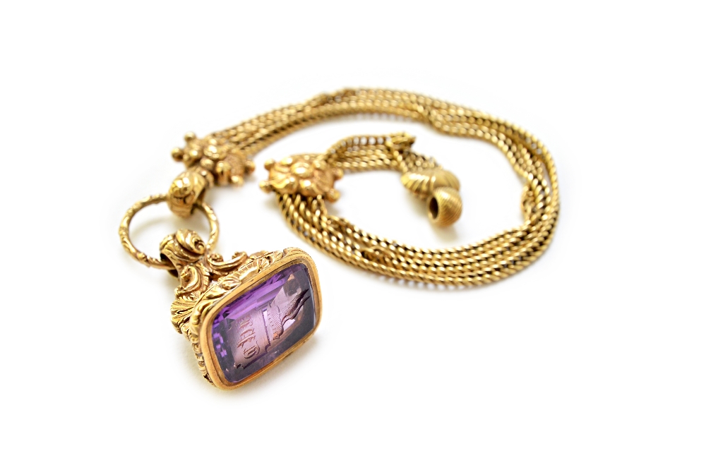 A Victorian gold and amethyst set pendant fob seal, seal engraved with a crest and a monogram,