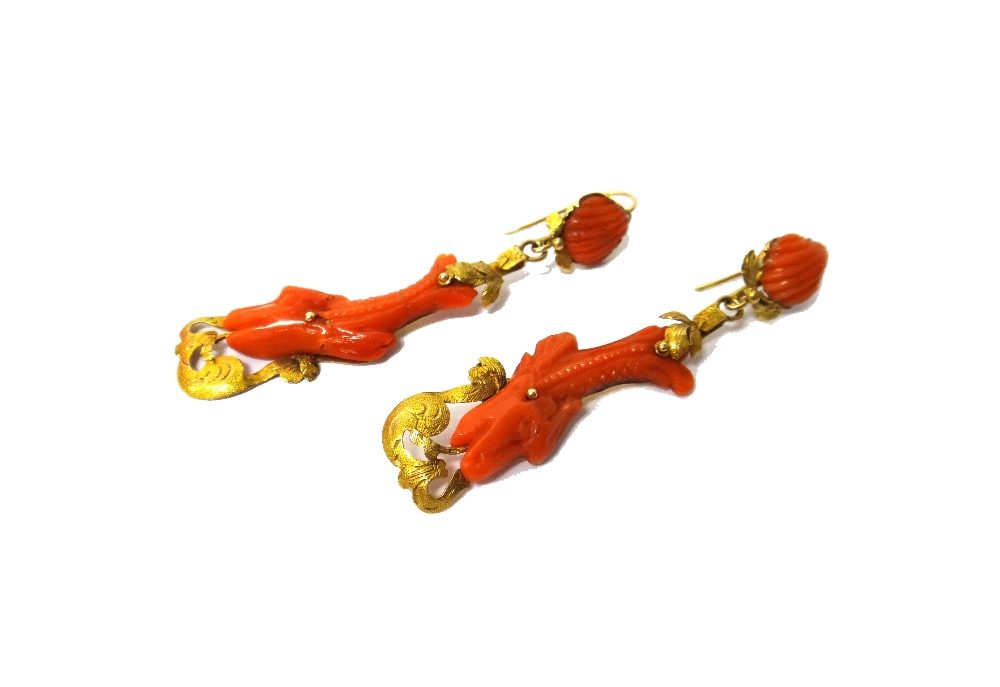 A pair of gold and carved coral pendant earrings,