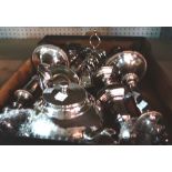 A quantity of silver plate including candlesticks, a toast rack, a tea pot and sundry.