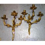 A pair of three branch acanthus moulded wall lights.