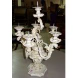 A white painted five branch candelabra.
