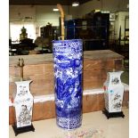 A pair of Oriental vases converted to lamps each with painted panels depicting figures and charter