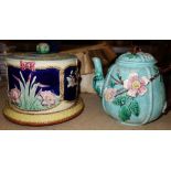 A Majolica tea pot and a Majolica cheese dish.