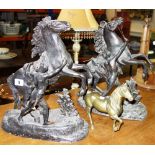 A pair of spelter marley horses and a bronze model of a horse.