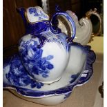 A blue and white pottery wash bowl and jug, and another shell lustre jug.